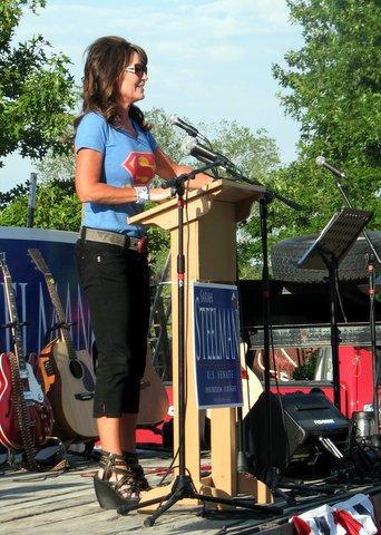 Sarah Palin in superman shirt and hot shoes