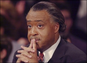 Sharpton fingers to lips