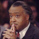 Sharpton fingers to lips